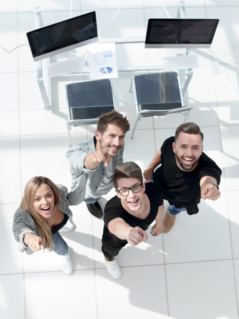 three-young-men-one-girl-show-up-with-their-fingers-top-view